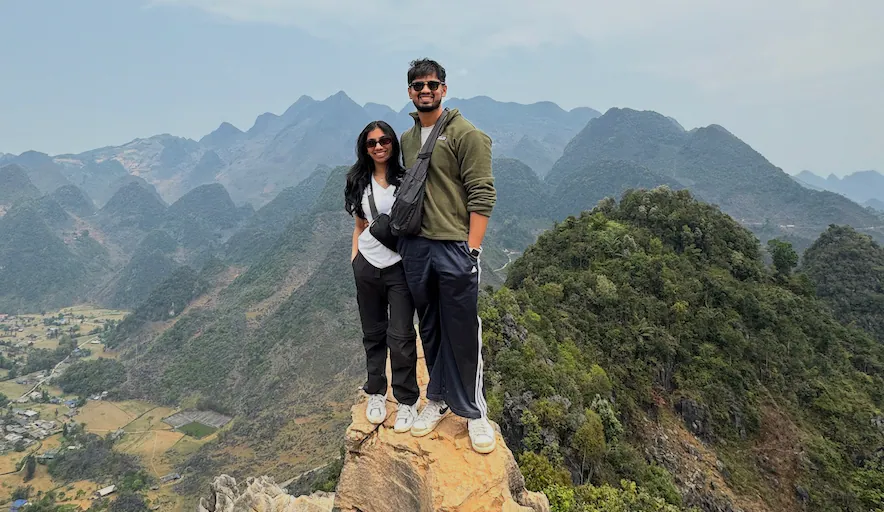 Perched on the rocky ledge with an endless expanse of karst peaks rolling out behind us.